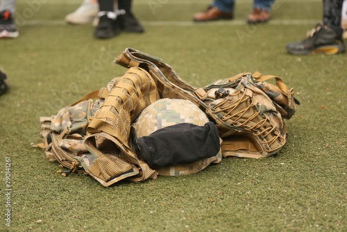 Military helmet with vest on the field