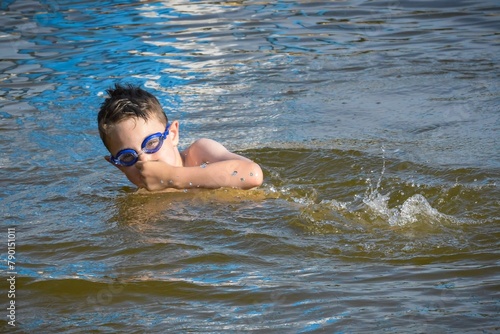 Young boy swimming