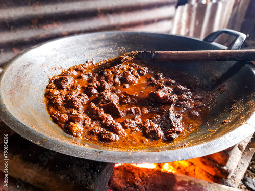 Beef Rendang food being cooked. one of the popular traditional Indonesian foods