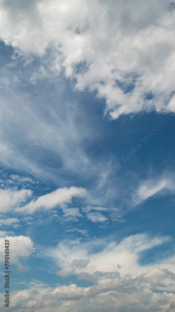 Vertical video - Timelapse of white puffy clouds rolling under blue sky Vertical video - Timelapse of white puffy clouds rolling under blue sky