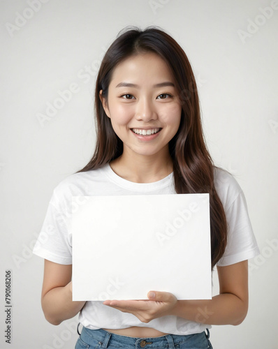 teenage woman holding a white paper