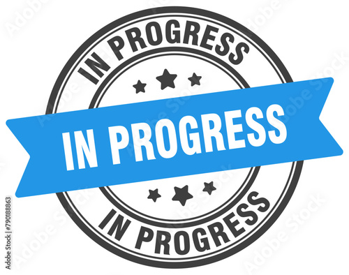 in progress stamp. in progress label on transparent background. round sign