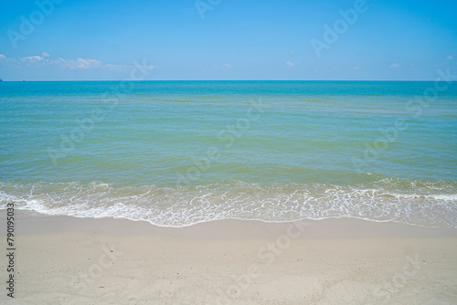 Beautiful landscape view of Summer beach sea. Landscape beach sand and seawater blue with blue sky background.