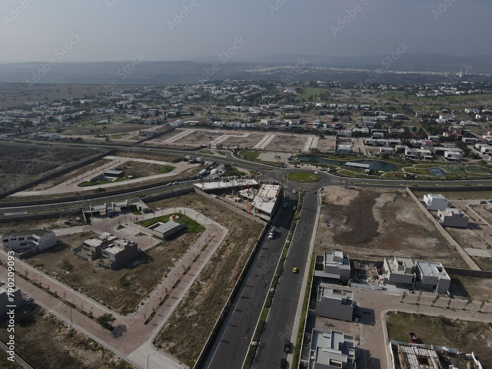 Aerial view of the goods warehouse. Logistics center in the industrial area of the city with a lot of roads, construction.