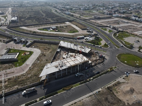 Aerial view of the goods warehouse. Logistics center in the industrial area of the city with a lot of roads
