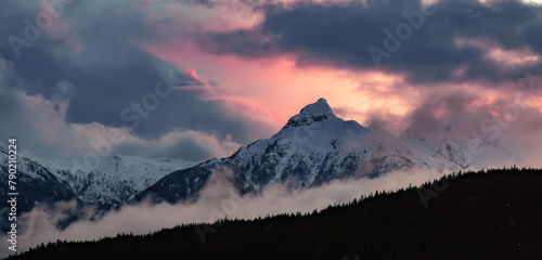 Dramatic Sunset of Canadian Mountain Landscape covered in Clouds