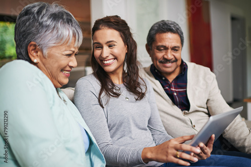 Senior parents, woman and tablet in living room for connection or bonding with tech. Family, home and mature people with young, female person and happy for togetherness on couch in community