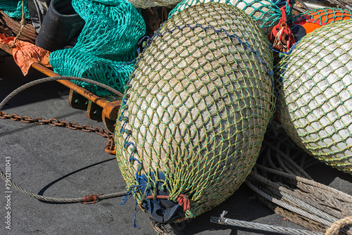 bladders used on a stern trawler are located outside on the harbor quay