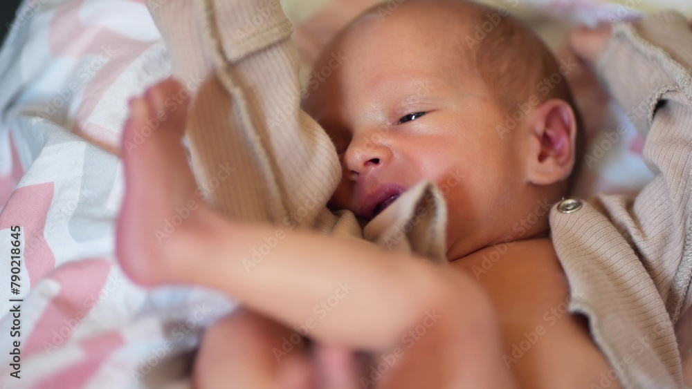 newborn baby. boy infant lies in a child bed. happy family birthday closeup baby concept newborn baby. boy infant lies in a child bed. happy family birthday closeup baby concept
