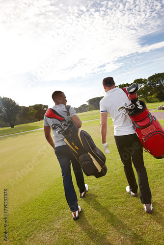 Sports, golf and men on field walking for game, match and competition on golfing course. Recreation, hobby and athlete friends with club driver on grass for training, fitness and practice outdoors