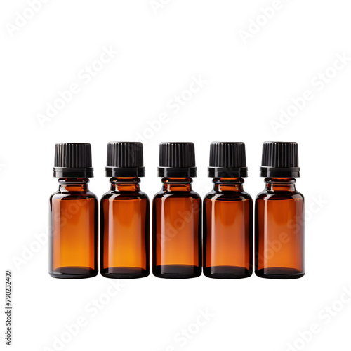 Small 10ml amber glass aroma therapy essential oil bottles with black plastic caps placed horizontally on an isolated background photo