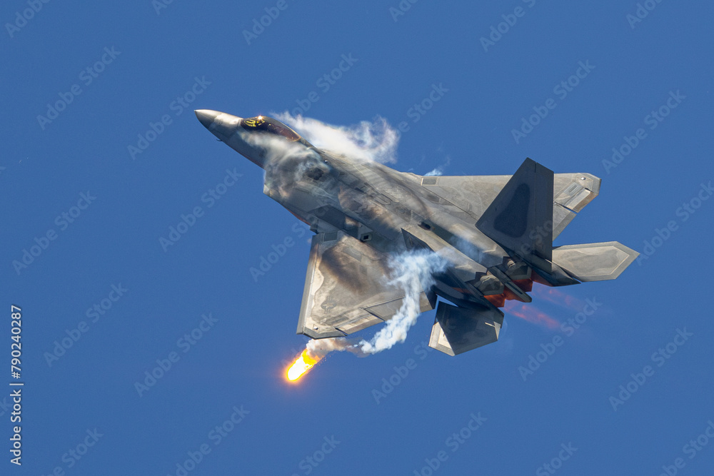 F 22 Rator In Flight Photos F-22 Raptor in a high G maneuver deploying flares, with afterburners on ...