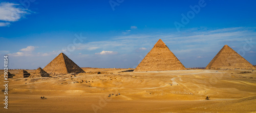 The Giza pyramid complex  in Egypt is home to the Great Pyramid  of Khufu, the Pyramid of Khafre, and the Pyramid of Menkaure, along with  smaller pyramids 
