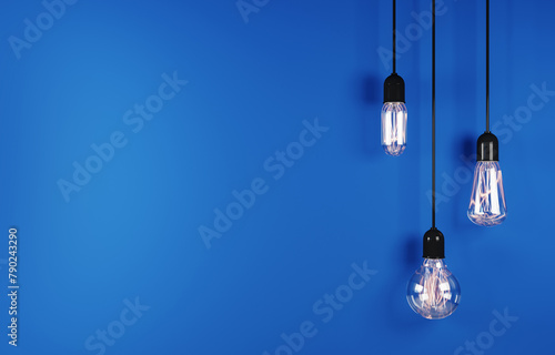 Vintage hanging light bulb on blue background. 3d rendering
