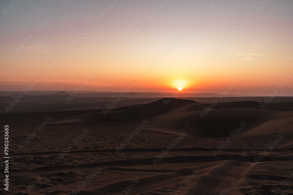 sunset over the dunes in the desert in huacachina sunset over the dunes in the desert in huacachina