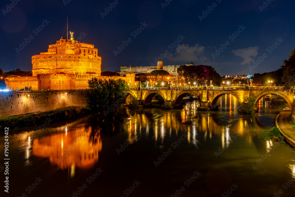 Castle of the Holy Angel (Castel Sant'Angelo) and St. Angel bridge over Tiber river at night, Rome, Italy