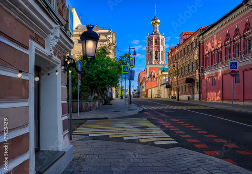 Petrovka street and High Monastery of St. Peter (Vysokopetrovsky Monastery) in Moscow, Russia. Architecture and landmarks of Moscow. Cozy cityscape of Moscow