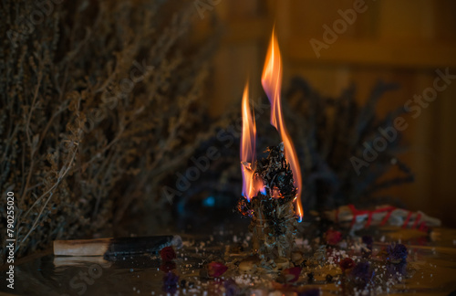 Heal and mental calmness. Cleansing aura and burning negative energy from human. Wax candle with herbs on altar