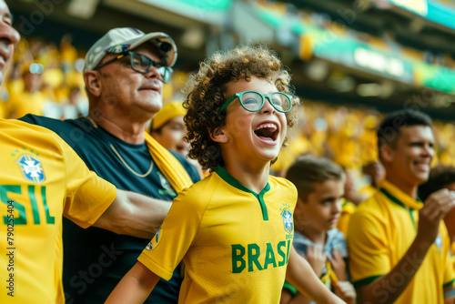 Brazilian football soccer fans in a stadium supporting the national team, father and son, Seleção  © PixelGallery