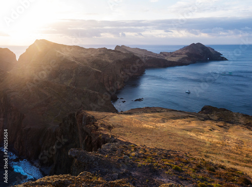 Cape Ponta de Sao Lourenco, Canical, East coast of Madeira Island, Portugal. Scenic volcanic landscape of Atlantic Ocean, rocks and cllifs and cloudy sunrise sky. Views from popular hiking trail PR8 photo