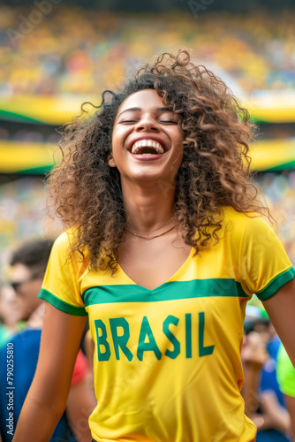 Brazilian football soccer fans in a stadium supporting the national team, Seleção
 photo