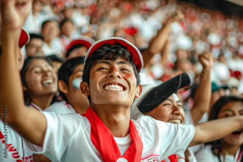 Peruvian football soccer fans in a stadium supporting the national team, La Blanquirroja