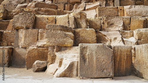 Close up of the Gigantic base rocks of the Great Pyramid of Khufu on Giza plateau made of tura limestone with each block weighing a ton  photo