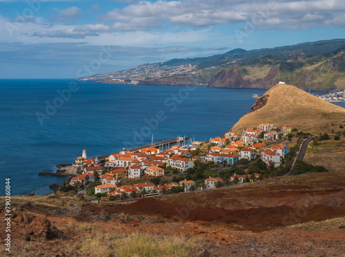 View of Quinta do Lorde Resort Hotel Marina and Canical, East coast of Madeira Island, Portugal. Scenic volcanic landscape of Atlantic Ocean with luxury resort buildings and town in background