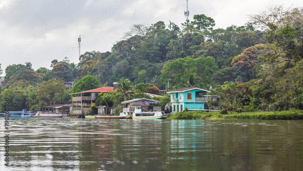 Scenic view of colorful houses of El Castillo village along the San Juan river in Nicaragua Scenic view of colorful houses of El Castillo village along the San Juan river in Nicaragua