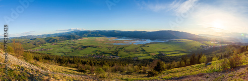 A panorama of the Cerkinško jezero lake. A large panoramic view of a lake in Slovenia. photo