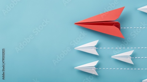 A standout red paper airplane