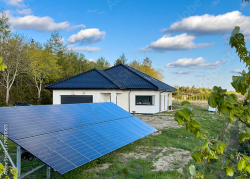 New house under construction with solar panels in the yard