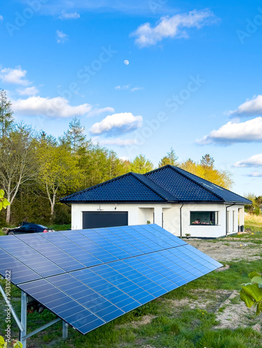 New house under construction with solar panels in the yard