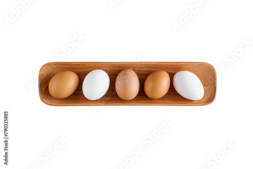 fresh white and brown chicken eggs lie in a clay serving plate. natural products, farm products, rustic. clipping path, isolate on white background © Маргарита Трушина
