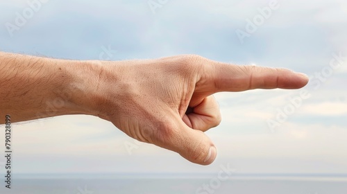 A man pointing his finger at the camera with a cloudy sky in background, AI © starush