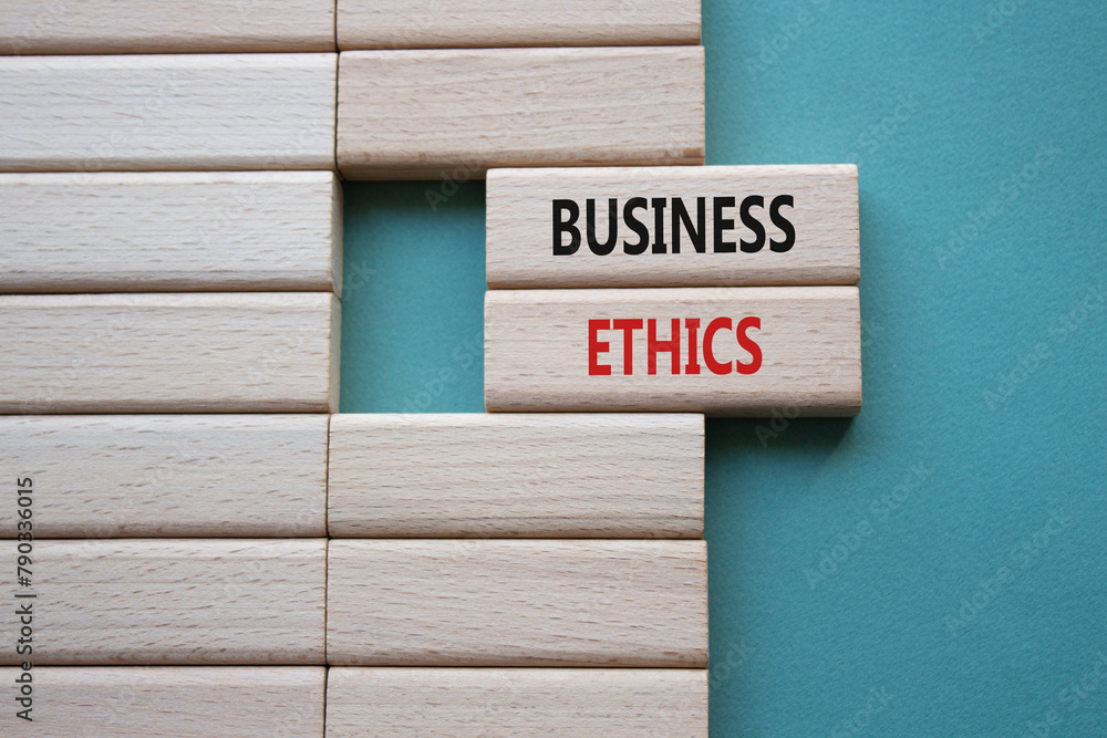 Business ethics symbol. Concept word Business ethics on wooden blocks. Beautiful grey green background. Business and Business ethics concept. Copy space Business ethics symbol. Concept word Business ethics on wooden blocks. Beautiful grey green background. Business and Business ethics concept. Copy space