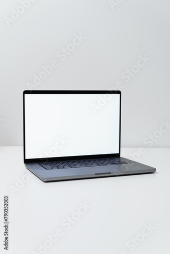 macbook laptop with white screen on a white table with white background, laptop screen mocap