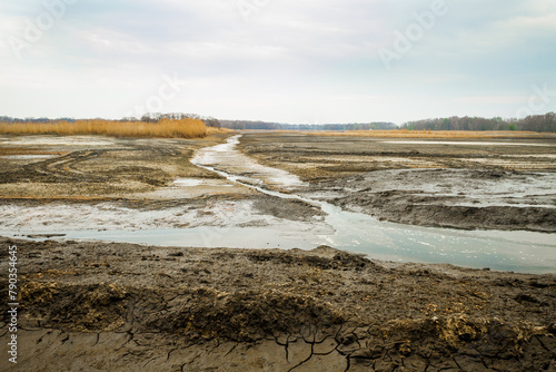 Dried bottom of a lake with mud © metapompa