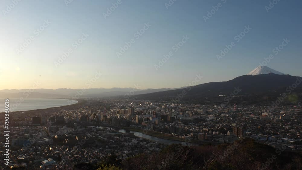 NUMAZU, SHIZUOKA, JAPAN - MARCH 2024 : Aerial high angle view of cityscape of Numazu city, Mount Fuji and Suruga bay in sunset. Time lapse shot, dusk to night. NUMAZU, SHIZUOKA, JAPAN - MARCH 2024 : Aerial high angle view of cityscape of Numazu city, Mount Fuji and Suruga bay in sunset. Time lapse shot, dusk to night.