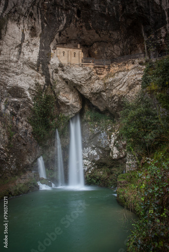 WATERFALL OF THE RELIGIOUS SANCTUARY OF COVADONGA EXCAVATED IN THE MOUNTAIN EUROPA PEAKS