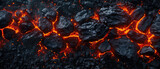 Smoldering charcoal with fiery cracks