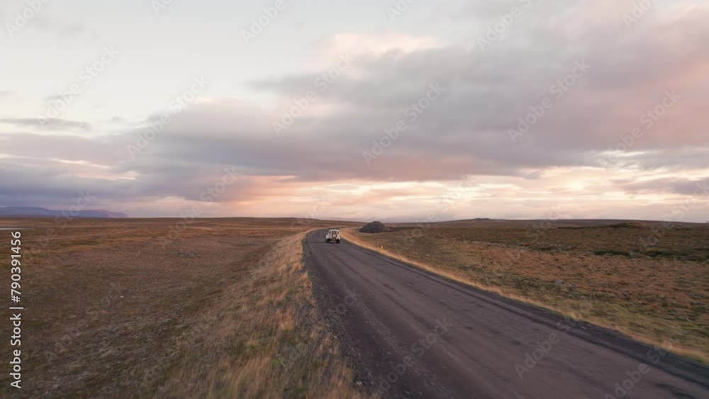 Iceland F-Road Sunrise Aerial Follow 4x4 White Vehicle on Dirt Road Epic Wide Lanscape. Iceland F-Road Sunrise Aerial Follow 4x4 White Vehicle on Dirt Road Epic Wide Lanscape.