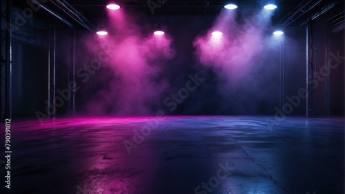 Stage with blue and pink lights casting smoke filled atmosphere