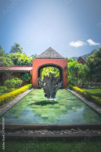 Water pool with sculpture in the inner garden of Rumerie de Chamarel, Mauritius