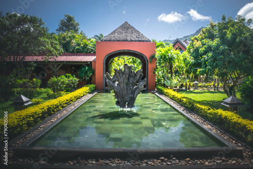 Water pool with sculpture in the inner garden of Rumerie de Chamarel, Mauritius