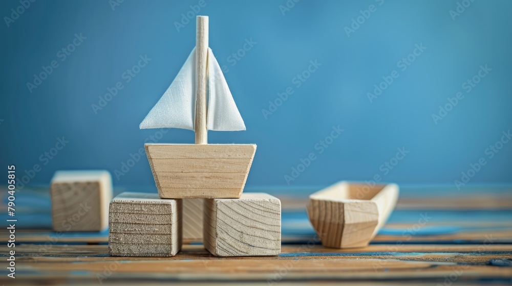 Company Information Symbol on Wooden Blocks in front of Blue Background with Boat Company Information Symbol on Wooden Blocks in front of Blue Background with Boat
