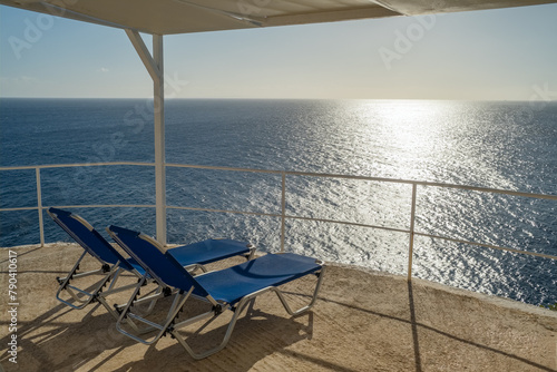 Two empty sunbeds with stunning sea view on Kefalonia island, Ionian sea, Greece.