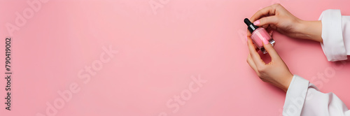 Manicurist with nail polish bottle web banner. Manicurist holding nail polish bottle on pink background.