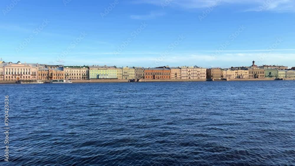 St. Petersburg, Russia - April 20, 2024. The University embankment of the Neva River. View of the sights of the city from the palace bridge. Panoramic view of the Neva River and the Palace embankment. St. Petersburg, Russia - April 20, 2024. The University embankment of the Neva River. View of the sights of the city from the palace bridge. Panoramic view of the Neva River and the Palace embankment.