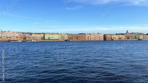 St. Petersburg, Russia - April 20, 2024. The University embankment of the Neva River. View of the sights of the city from the palace bridge. Panoramic view of the Neva River and the Palace embankment. photo